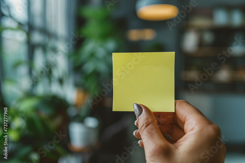 women hand holding sticky note for add text