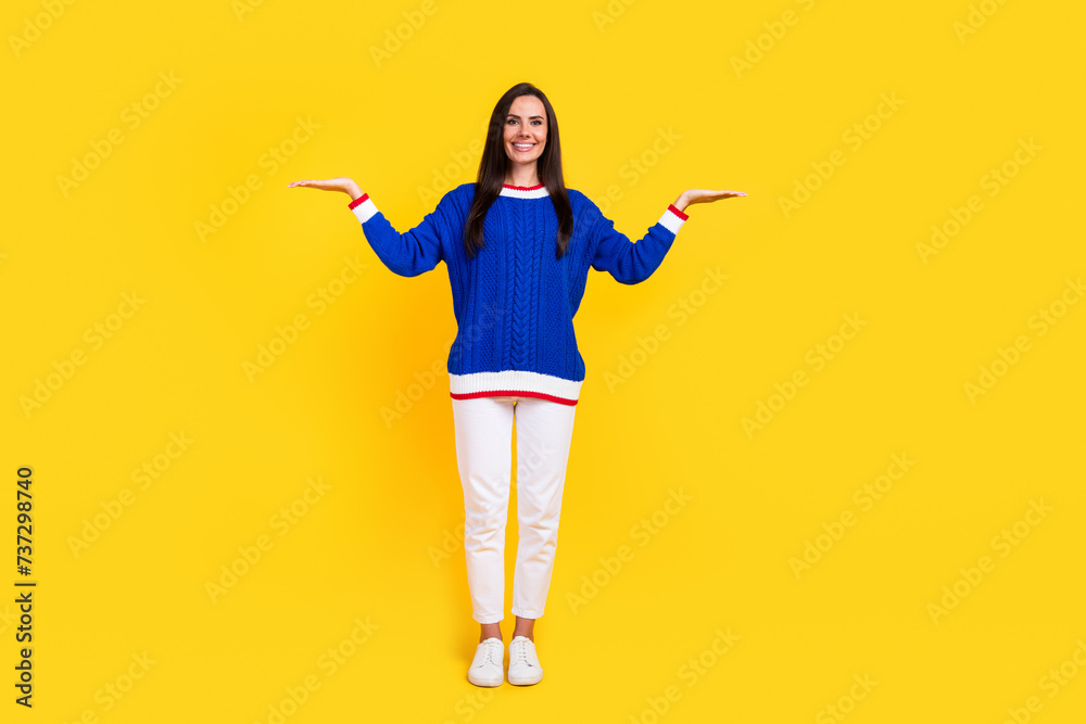 Full length body photo of smiling model brunette hair latina lady demonstrate two arms scales isolated over yellow color background