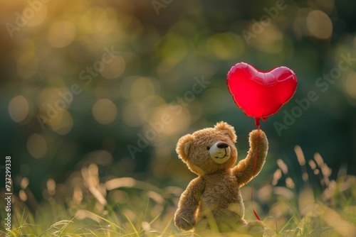 Cute teddy bear holding a red heart balloon amidst the beauty of nature. Expressing love on Valentine's Day with a romantic gesture. Blurred natural background adds to the charm.
