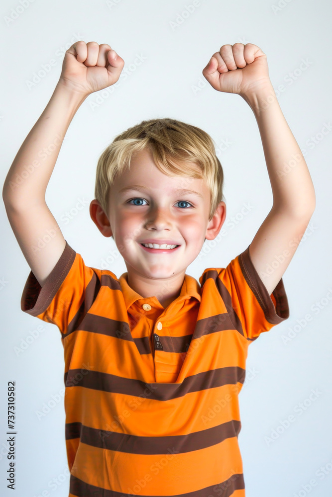 Happy Boy with Arms Raised in Striped Orange Shirt Happy Boy with Arms Raised in Striped Orange Shirt