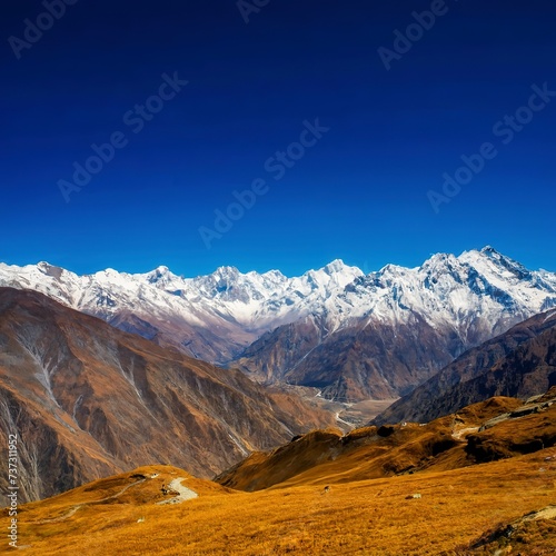 Beautiful landscape of Chopta valley with Snow covered beautiful mountain peaks against the blue sky at north Sikkim India photo