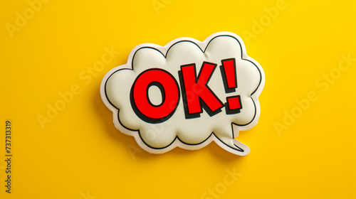ok word in comic speech bubble style with explosion in pop art on trendy yellow background photo