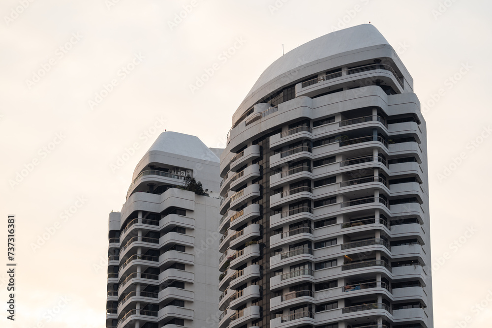 Twin Residential Towers with Curved Balconies at Sunset