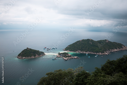 Aerial View of a Tropical Island with Boats and Crystal Clear Waters © Maria