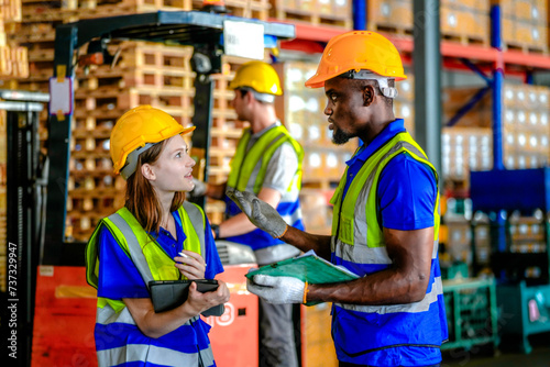 Concept workers people operation in industrial. team of factory industrial warehouse. Male giving some advice to team. Group of Diversity engineer factory people meeting.