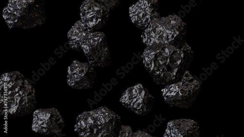 Realistic looping 3D animation of the anthracite coal chunks falling from the top rendered in UHD with alpha matte