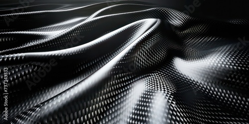 Close-up modern abstract design featuring dark carbon fiber texture. photo