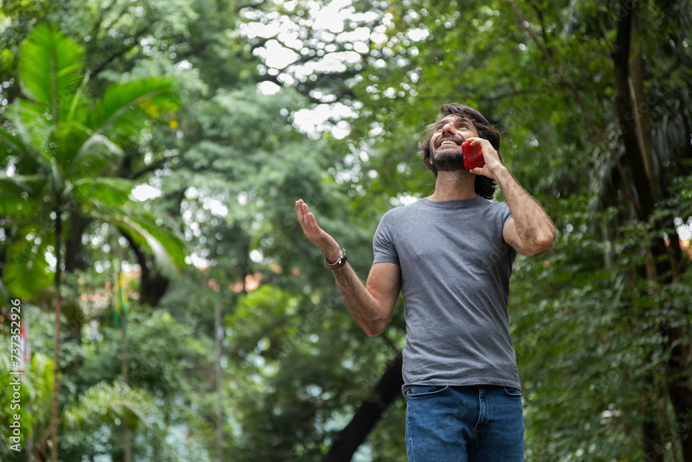 View of a young man with smartphone View of a young man with smartphone