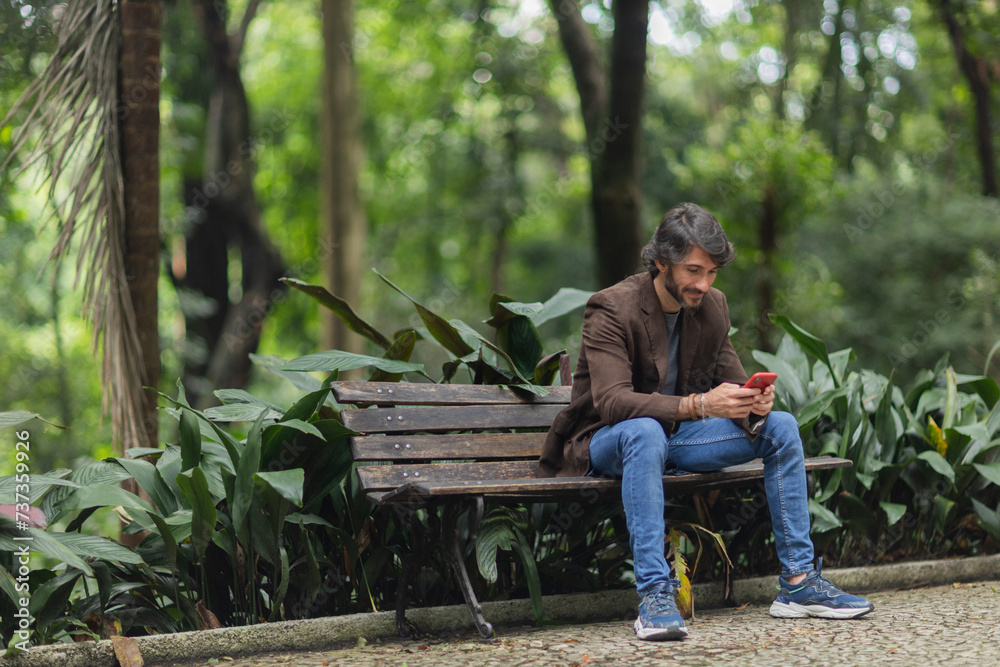 Fototapeta premium View of a young man with smartphone