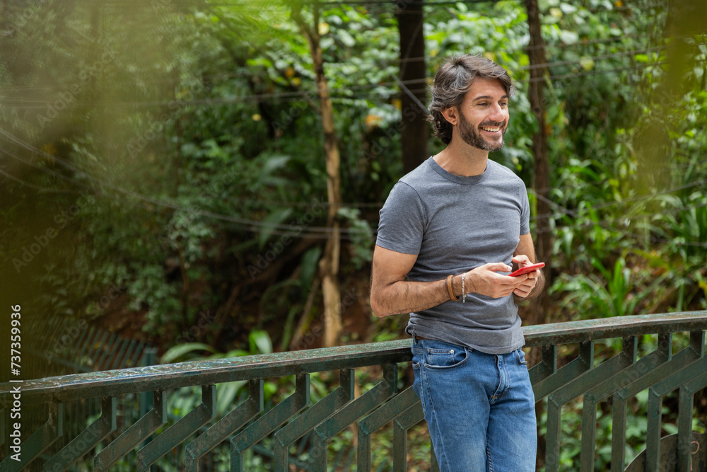 View of a young man with smartphone View of a young man with smartphone