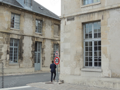 Person in front of a building - École Militaire - Paris - France © Murilo