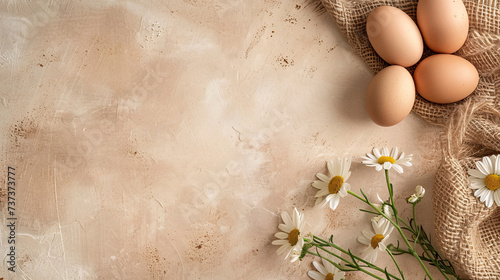 easter eggs and flowers on brown background with copy space area