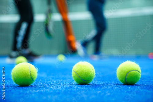 Close-up of tennis ball on blue court