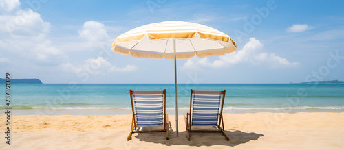 Summer chairs and umbrellas are set up on a tropical beach with a backdrop of blue sky and sea.AI Generative