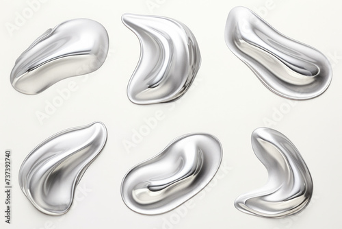 A fluid silver design on a white canvas in a visual arts exhibit