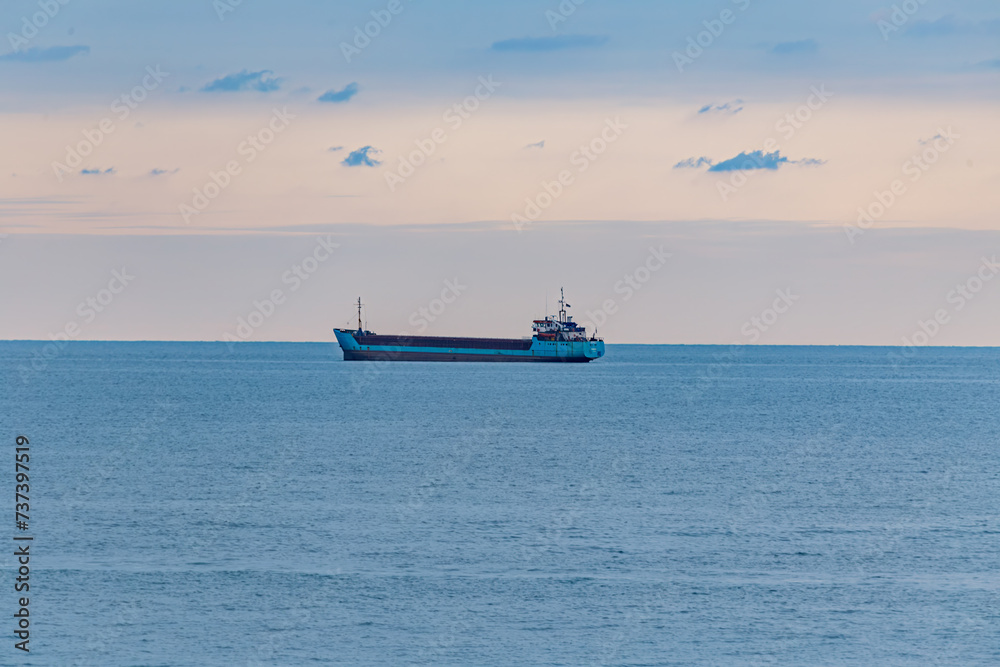 View of the sunset and the ship by the sea