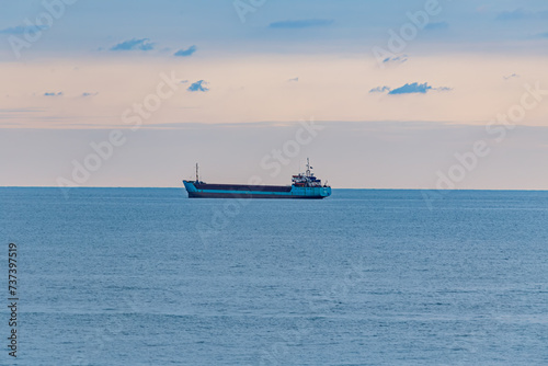 View of the sunset and the ship by the sea © viktor