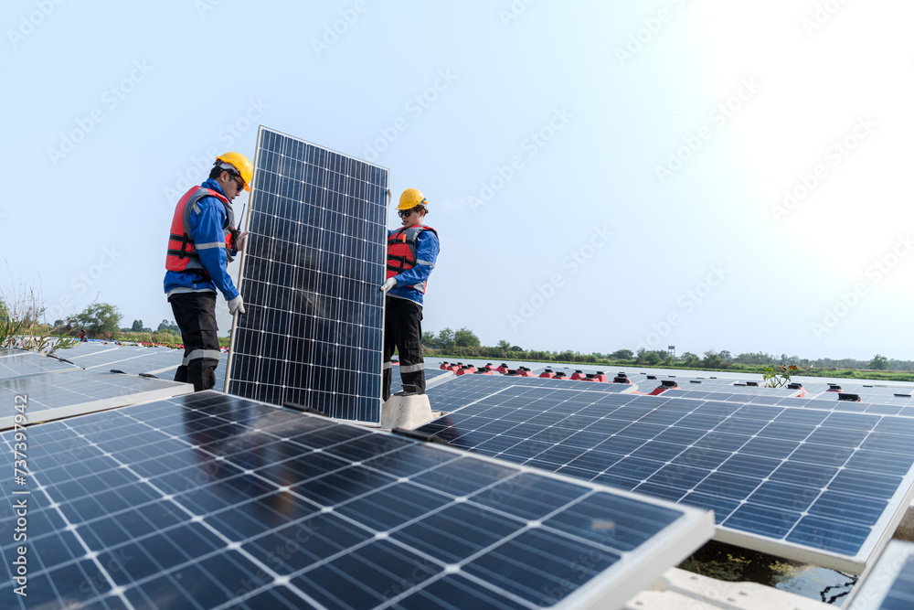 custom made wallpaper toronto digitalPhotovoltaic engineers work on floating photovoltaics. workers Inspect and repair the solar panel equipment floating on water. Engineer working setup Floating solar panels Platform system on the lake.