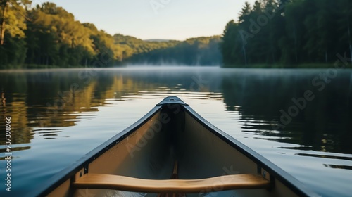 A serene journey awaits as you glide through the still, glassy waters of a tranquil lake. The ethereal glow of dawn casts a captivating mirror effect, enchanting the senses and evoking a pro