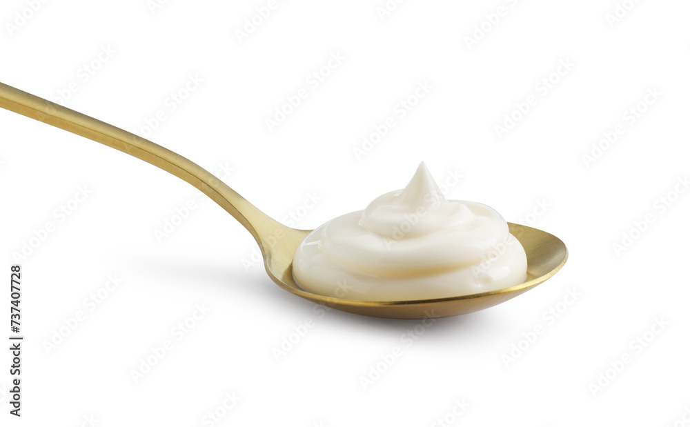 Golden spoon with mayonnaise isolated on white Golden spoon with mayonnaise isolated on white