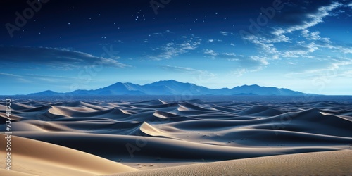 A captivating desert landscape showcasing expansive sand dunes with towering mountains in the distance.