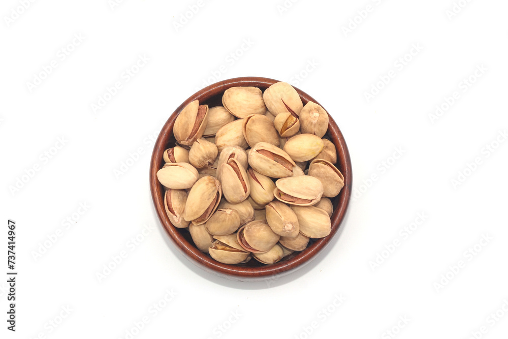 Pistachio nuts, pistachios in Wooden Bowl Isolated on a white background. Pistachio nuts, pistachios in Wooden Bowl Isolated on a white background.