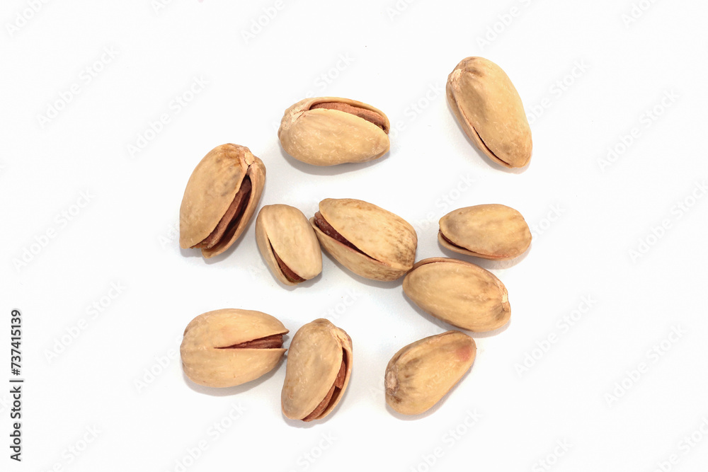 Pistachio nuts, pistachios close up. Isolated on a white background.