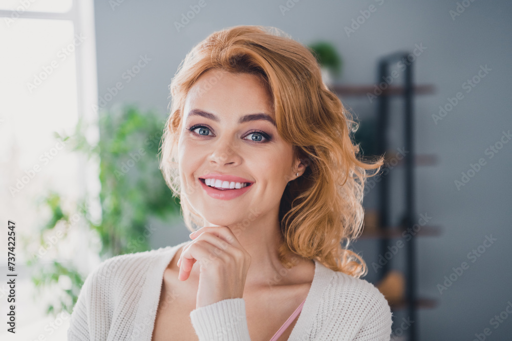 Photo of nice positive intelligent girl beaming smile arm touch chin brainstorming free time apartment indoors