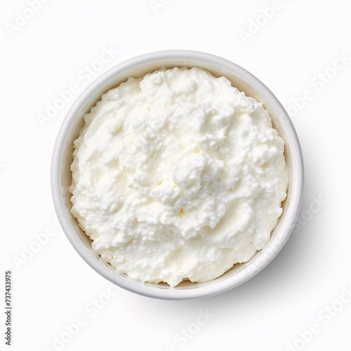 Bowl of cottage cheese isolated on white background, top view