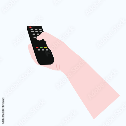 hand holds remote control on light blue background