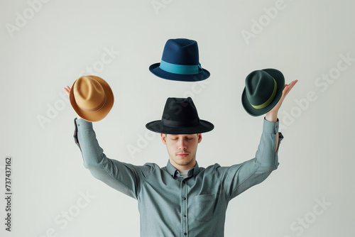 A person balancing multiple hats  and multitasking abilities of the best job candidate photo