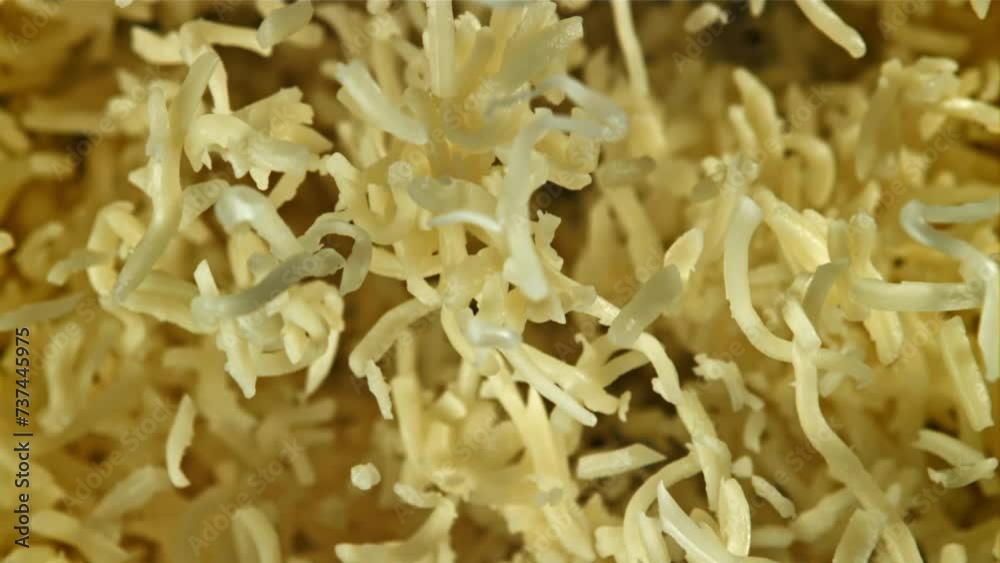 Shredded cheese flies up. Filmed on a high-speed camera at 1000 fps. High quality FullHD footage Shredded cheese flies up. Filmed on a high-speed camera at 1000 fps. High quality FullHD footage
