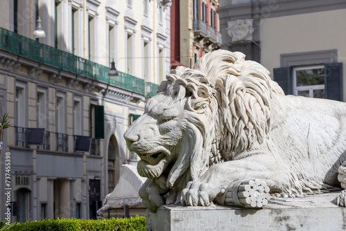 Stone lion statue at the base of the Monument to the Martyrs on Piazza dei Martiri, Naples, Italy photo