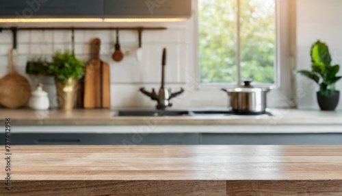 empty table top over defocused kitchen with copy space