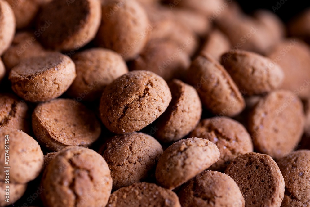 A macro portrait of a delicious dutch treat called pepernoten. Pepper nuts are a traditional cookie during holidays and saint nicholas or sinterklaas in dutch and it tastes like gingerbread. A macro portrait of a delicious dutch treat called pepernoten. Pepper nuts are a traditional cookie during holidays and saint nicholas or sinterklaas in dutch and it tastes like gingerbread.