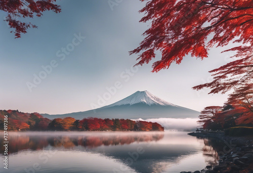 Colorful Autumn Season and Mountain with morning fog and red leaves at lake
