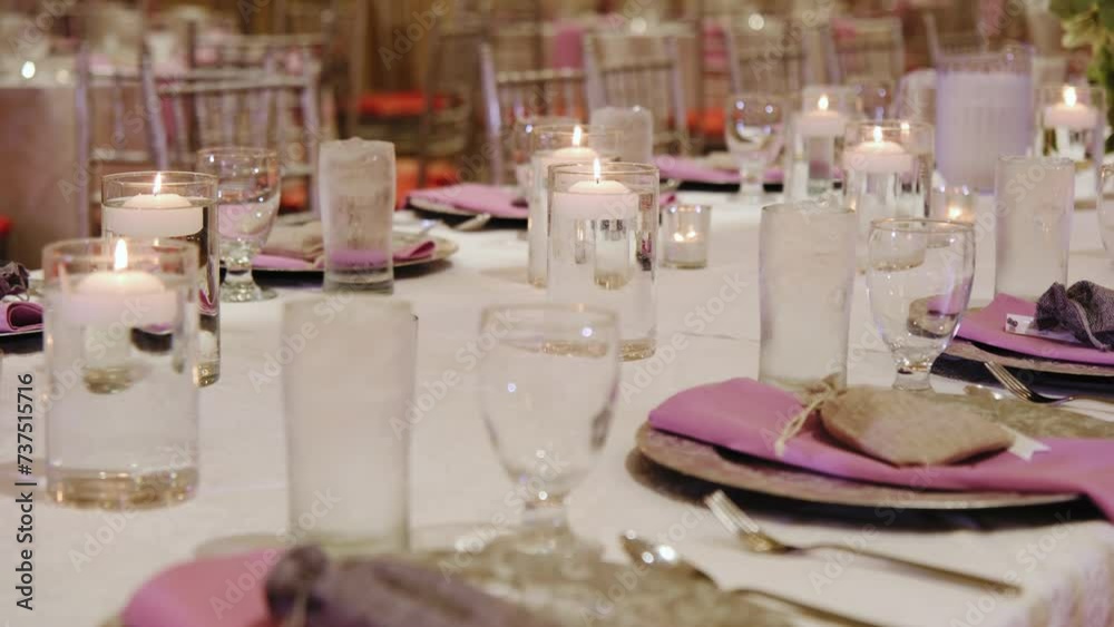 Close up shot of elements restaurant filled with tables and candles. Wedding ceremony Close up shot of elements restaurant filled with tables and candles. Wedding ceremony