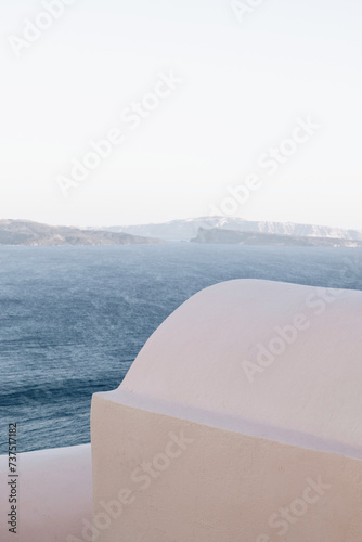 pastel colored building with view on the caldera in Santorini, Cyclades, Greece