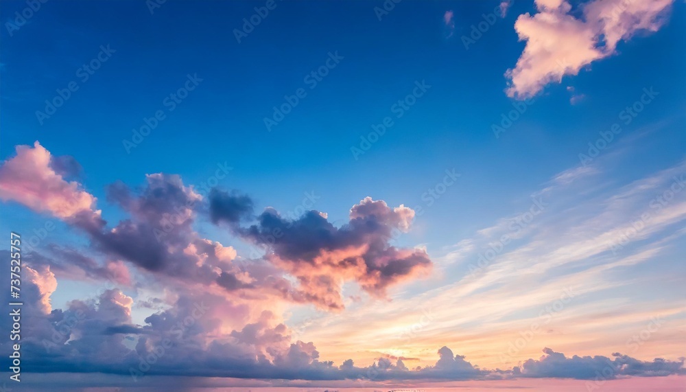 blue sky background with white and pink clouds at sunset