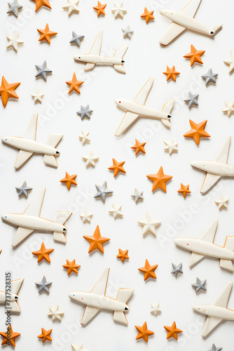 Airplane and stars shaped cookies on white background. Top view. AI generated