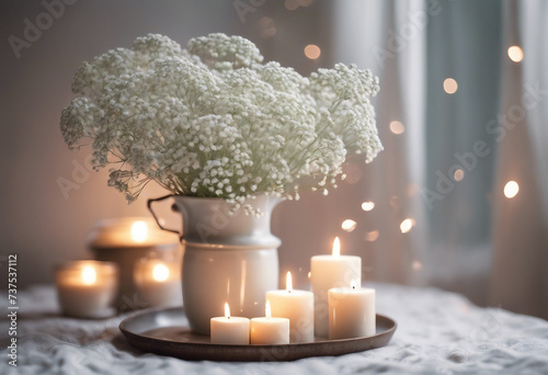 White arrangement of baby's breath flowers and candles