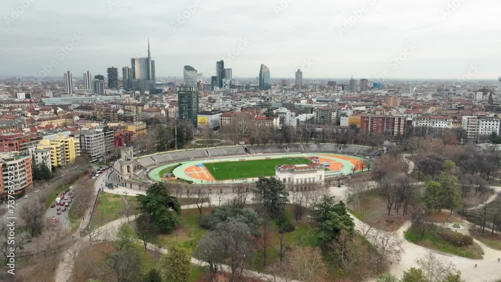 Aerial view of Athletic stadium surrounded by trees in public park in 4k Aerial view of Athletic stadium surrounded by trees in public park in 4k