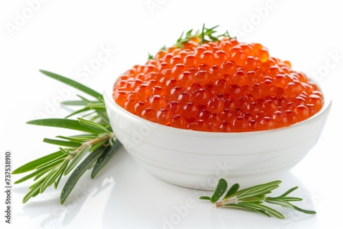 Delicious red caviar and rosemary in a bowl white background