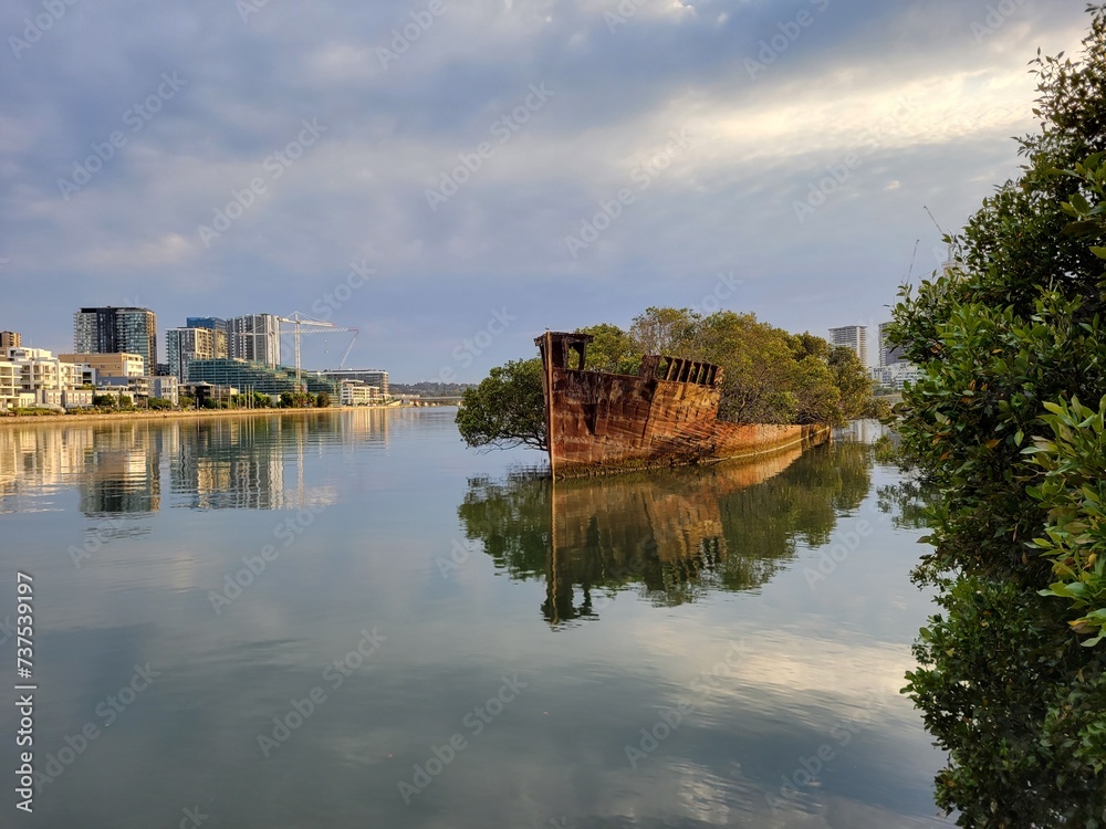 The Abandoned SS Ayrfield (historic ship) in Wentworth Point Harbor at Sunrise - Sydney, Australia