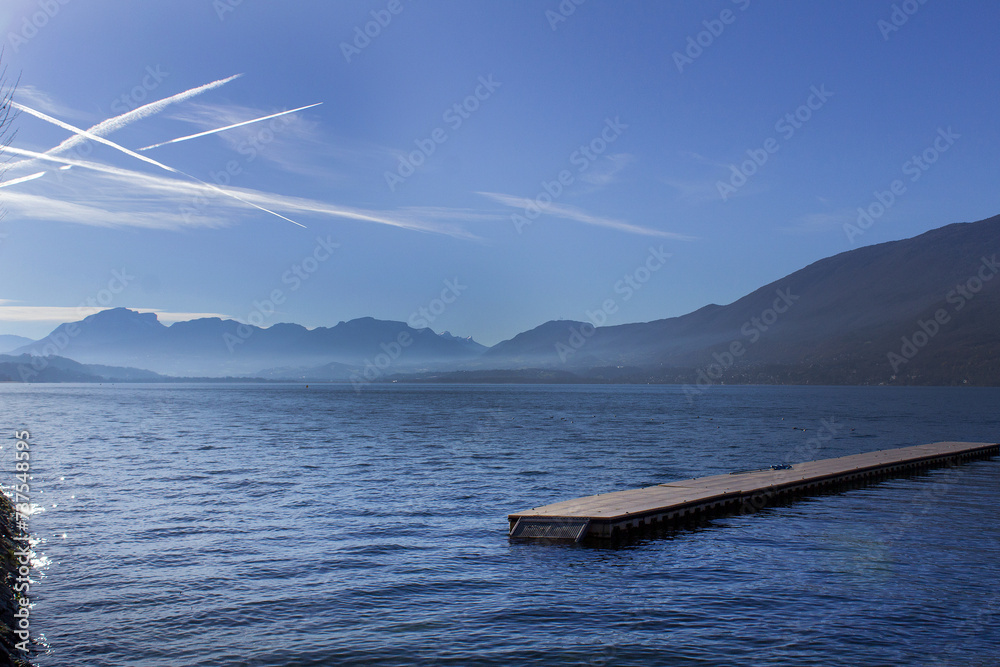 Water  and blue sky panoramic view Lake du Bourget Aix les bains town Auvergne-Rhône-Alpes region France - obrazy, fototapety, plakaty 