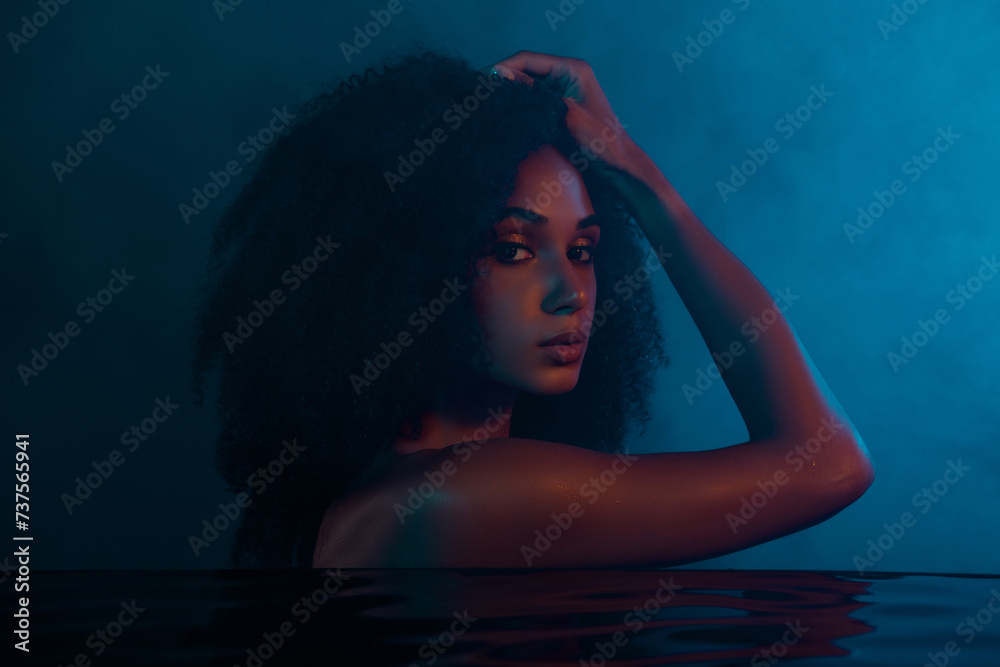 Photo of stunning gentle lady have bath time touching hairdo washing in warm water over dark background