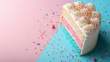 A slice of layered birthday cake with white icing and sprinkles, on a split pink and blue background.
