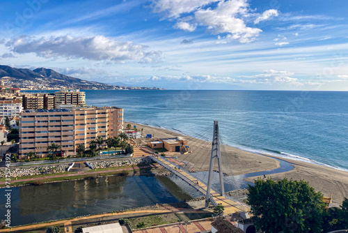 Panoramic view on cityscape and see promenade from Sohail castle on sunset in Fuengirola, Spain photo