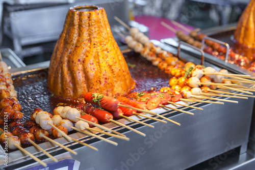 Spicy Skewered Pork Ball Cooking on Hot Grill