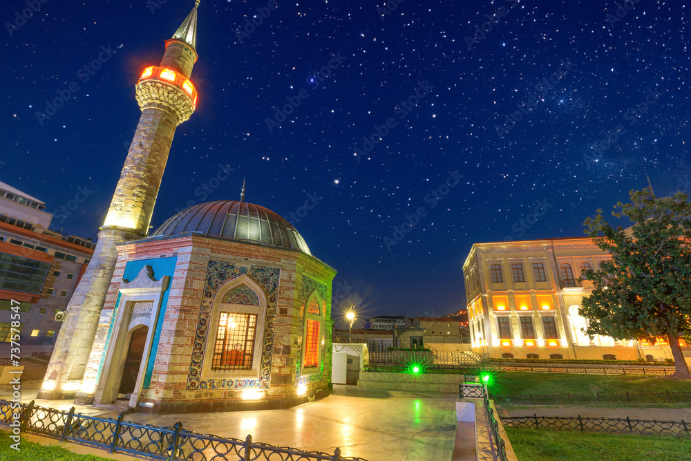 Konak Mosque with octagonal shape and intricate tilework, serene oasis ...